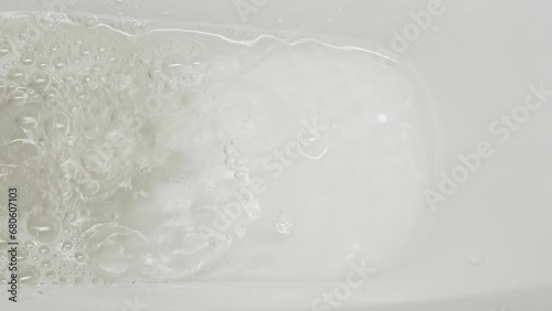 A stream of urine in a white toilet