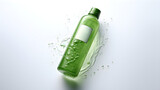 Green Bottle shower cleanser with natural extracts on gray background. Close-up
