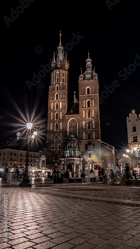 The main square of the old town in Krakow in the night lights.