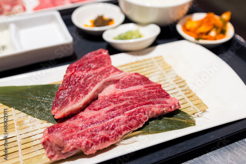 Slice of the fresh raw beef in the yakiniku restaurant