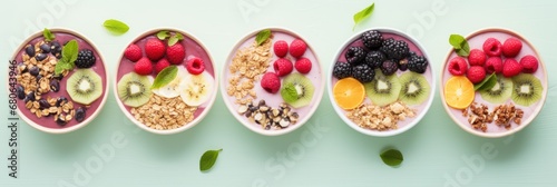 Selection of vegan smoothie bowls with vibrant fruit toppings and a sprinkle of granola.