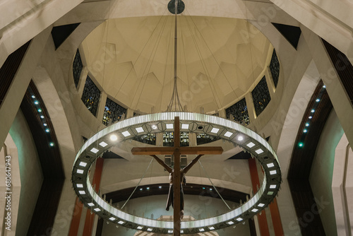 Art Deco interiors of Catholic minor basilica national shrine with massive dome and arch vaults  murals  altar and columns with Renaissance Revival style facade tourist pilgrim attraction