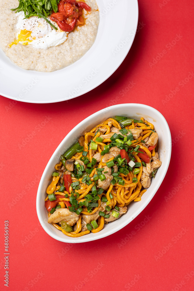 Asian cuisine. Noodles with chicken. Close up