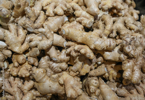  fresh organic ginger on market in heap