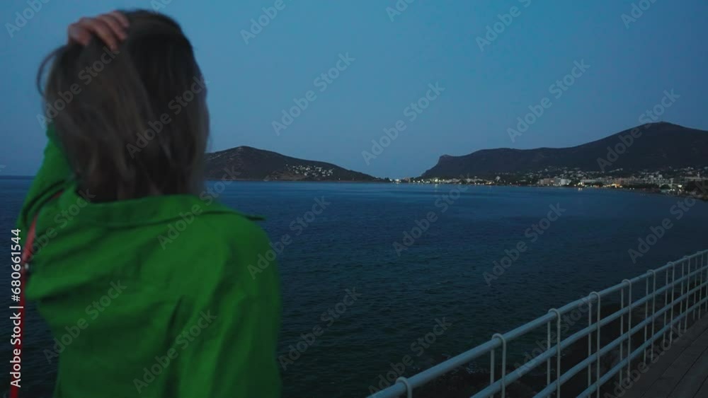 Woman on the waterfront in Porto Rafti, Greece. Woman on the waterfront in Porto Rafti, Greece.