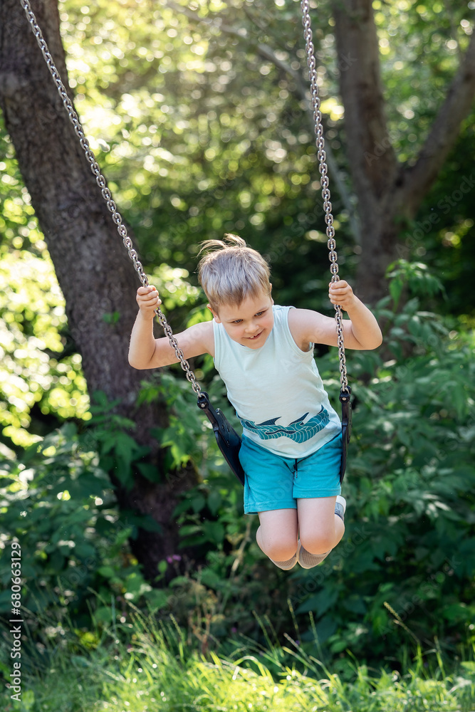 Happy child swings around on sunny nature background. Happy child swings around on sunny nature background.