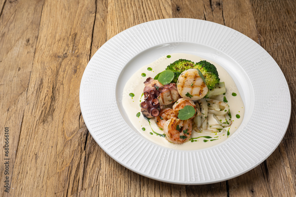 Grilled seafood with broccoli and sauce Grilled seafood with broccoli and sauce