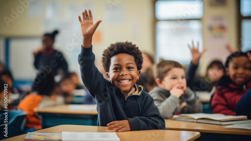  A Smiling African-American Boy Actively Participating in a Classroom Lesson © Ananncee Media