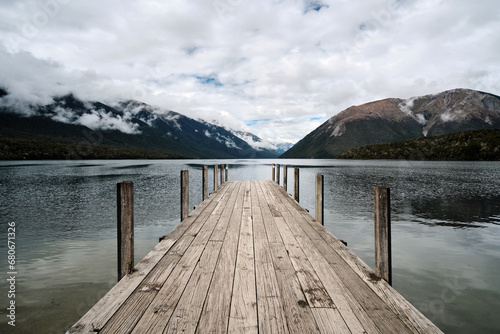 wooden pier on lake in new zealand, nelson lake photo