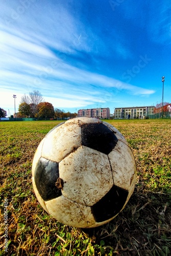 football in a winter field with muddy ground