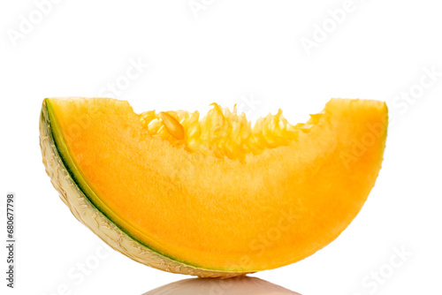 One sweet slice of organic melon, close-up, on a white background.