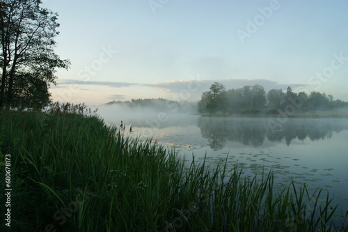 Tranquil Morning  Reflection of Nature s Beauty in Misty Lake Landscape