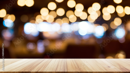 Empty wood table and Coffee shop Restaurant blur background with bokeh image.