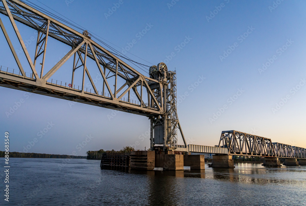 Sailing on Mississippi river under Wabash Railroad bridge near Hannibal, Missouri with Illinois on the other bank