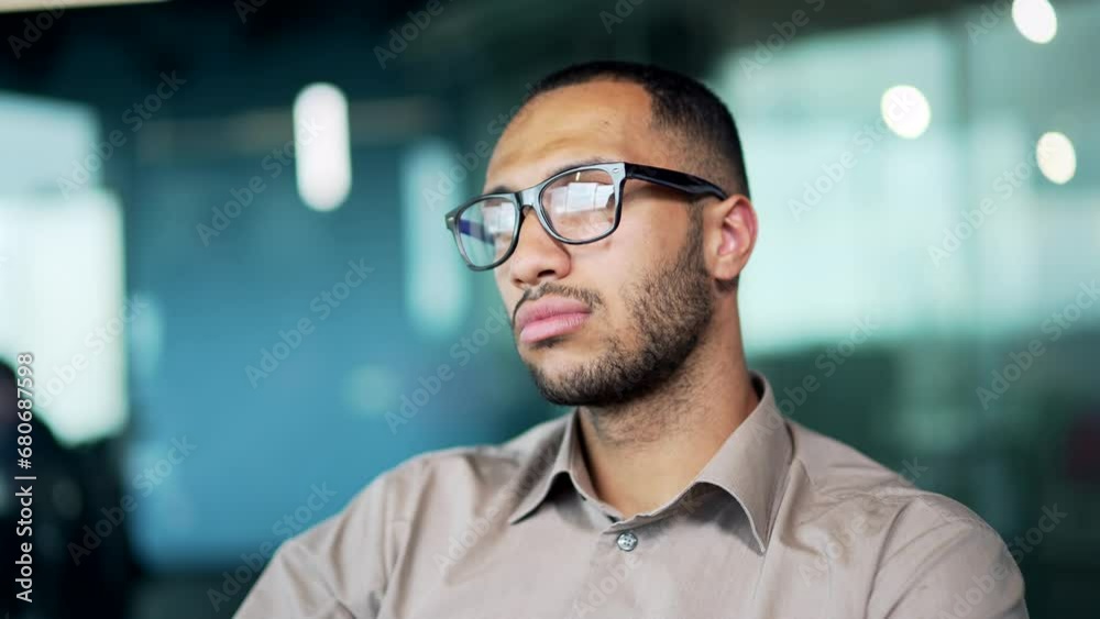 Thoughtful serious arab businessman in eyeglasses looking away lost in thoughts thinking. Close up focused pensive Arabian man. Business vision idea Confident serious focused Employee, entrepreneur Thoughtful serious arab businessman in eyeglasses looking away lost in thoughts thinking. Close up focused pensive Arabian man. Business vision idea Confident serious focused Employee, entrepreneur
