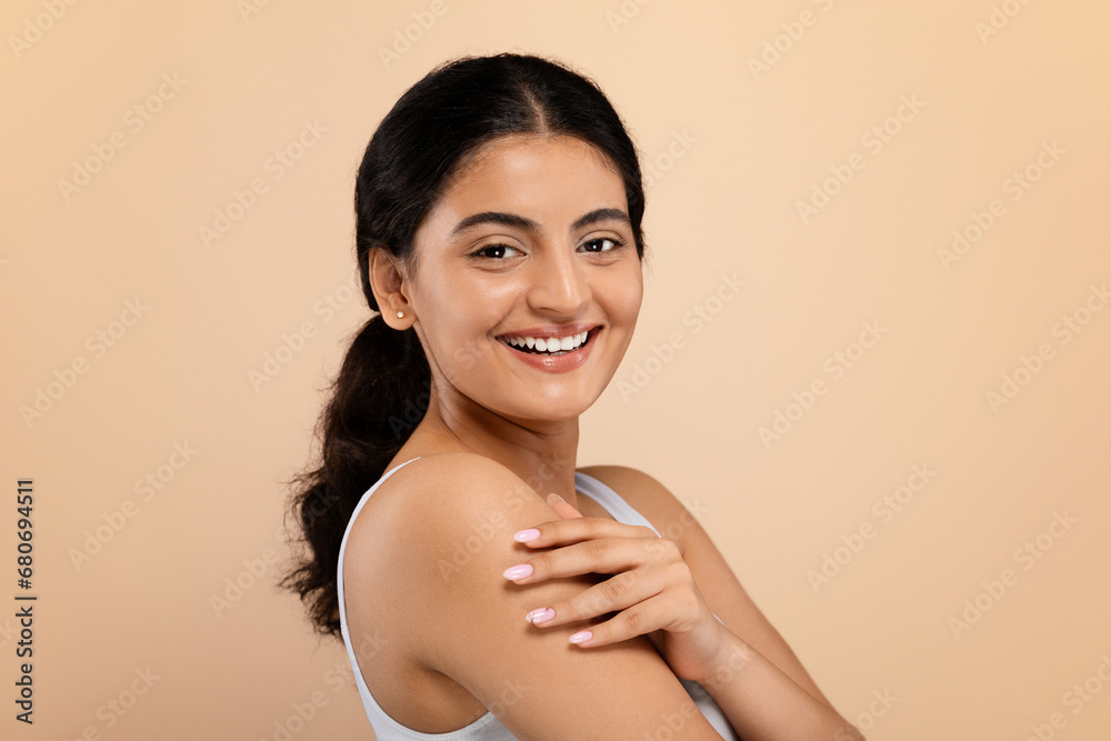 © Prostock-studio - Natural Beauty. Portrait of cheerful young indian female with beautiful skin © Prostock-studio - Natural Beauty. Portrait of cheerful young indian female with beautiful skin