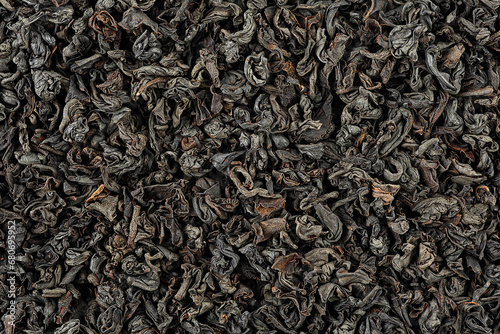 Background of dry black tea leaves, top view. Dried black tea as background.