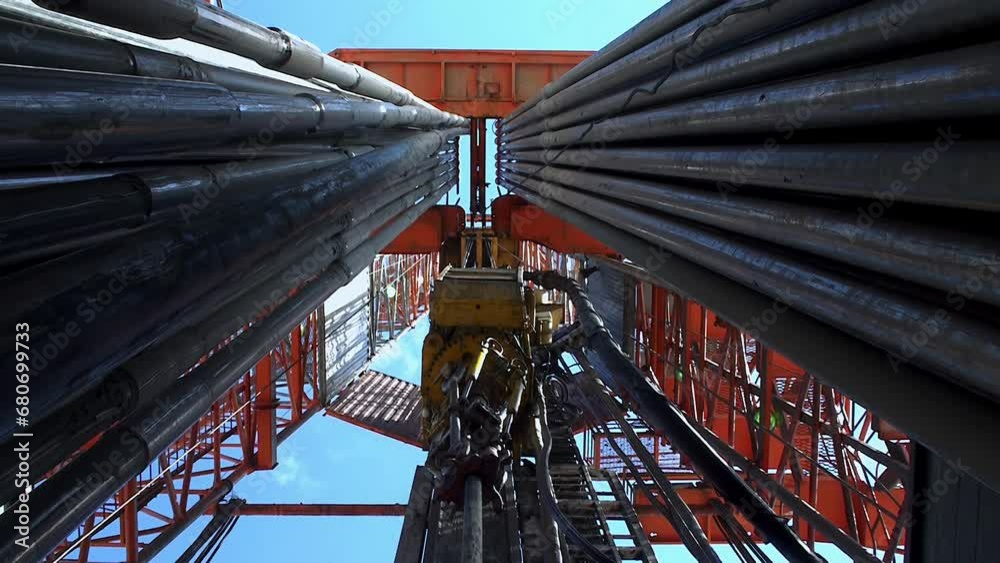 Drilling of the well. Looking upwards inside the drilling rig. Drilling of the well. Looking upwards inside the drilling rig.