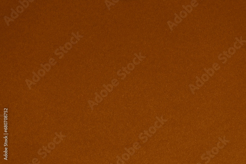 Detail of brown colour paper sheet (school poster board, bristol board) texture. Plain background