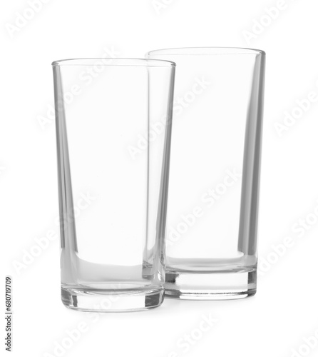 Two clean empty highball glasses isolated on white