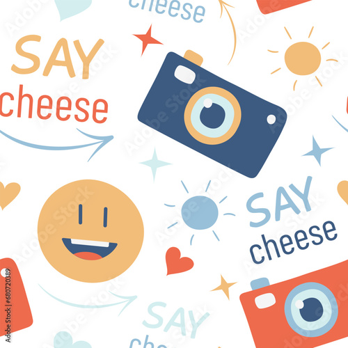 Camera pattern, emoticon and text Say Cheese. Take a photo. Snapshot. Smile for the photo. Lens technique. Smiling emoji. Seamless print. Arrow, sun, heart symbols. Color image. Vector illustration.