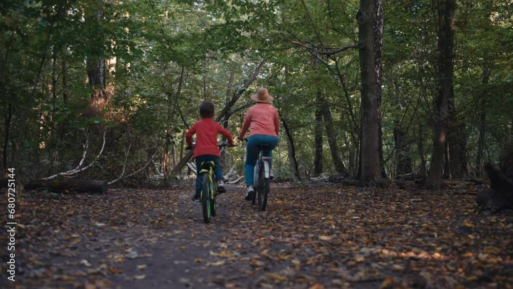 Nature's Playground: Family Bonding through Cycling Adventures in the Park. High quality 4k footage Nature's Playground: Family Bonding through Cycling Adventures in the Park. High quality 4k footage