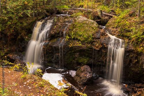 Two Waterfalls On A Creek In The Woods During Autumn photo