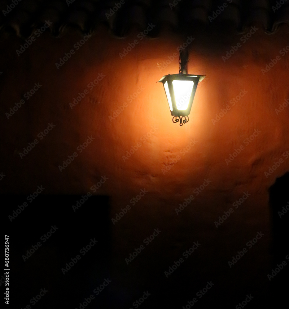 Bright street lantern with a very dark and myterious atmosphere in the Monasterio de Santa Catalina, Arequipa, Peru. Bright street lantern with a very dark and myterious atmosphere in the Monasterio de Santa Catalina, Arequipa, Peru.