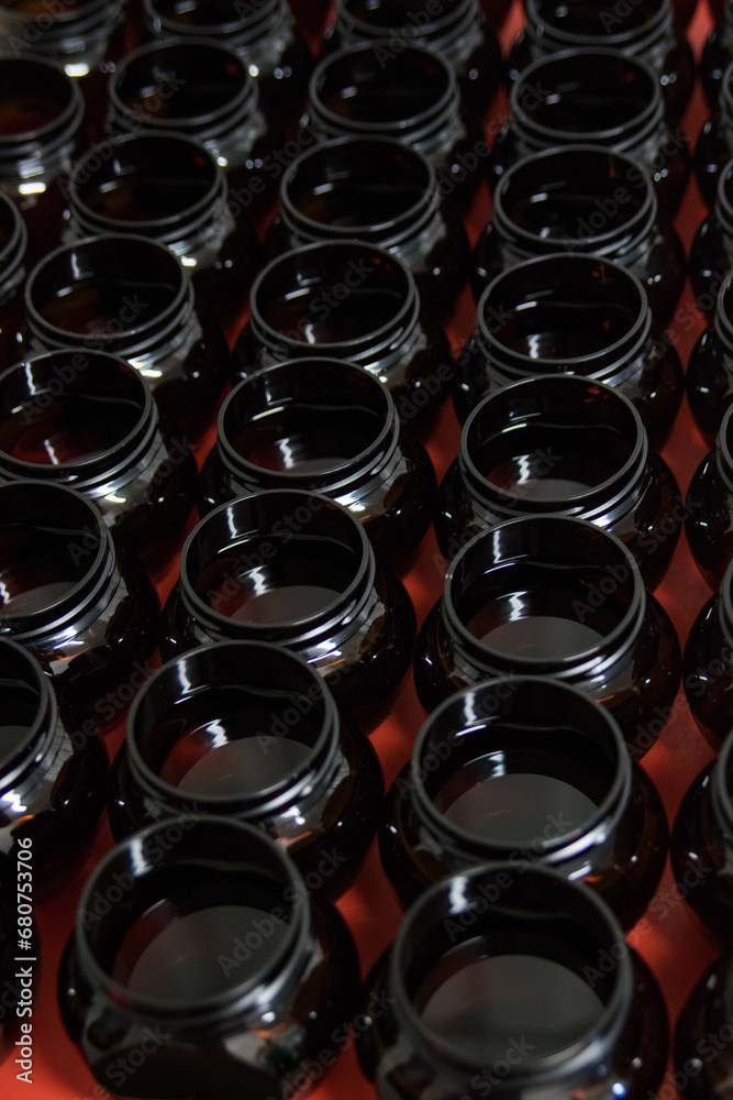 Assorted bottles in a row, close-up arrangement, indoor backdrop. Assorted bottles in a row, close-up arrangement, indoor backdrop.
