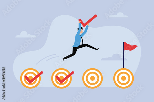 Businessman achieving business goals, jumping on target check