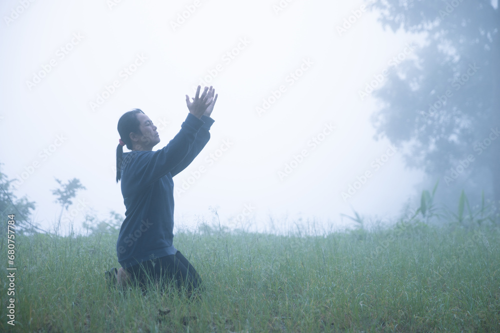 Silhouette woman on sunset background. Woman raising his hands in worship. Christian Religion concept background. Person hands open palm up worship. God helping repent catholic easter lent mind pray. Silhouette woman on sunset background. Woman raising his hands in worship. Christian Religion concept background. Person hands open palm up worship. God helping repent catholic easter lent mind pray.