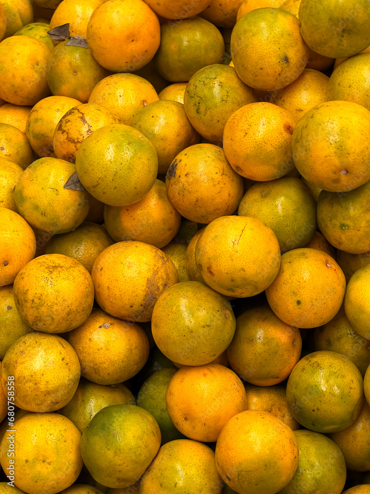 fresh ripe orange fruit as background, top view