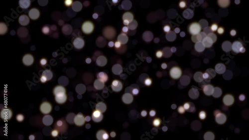 Beautiful flow moving white blurred bokeh bubbles lights Seamless loop motion on black background. pastel particles on black background background loop. photo