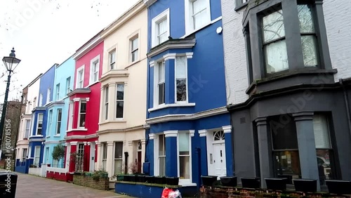 Lineup of colorful Victorian homes in the London suburb of Notting Hill, UK photo