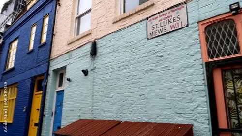 Street sign for St. Lukes Mews, located in W11 Notting Hill, London. Colorful house doors photo