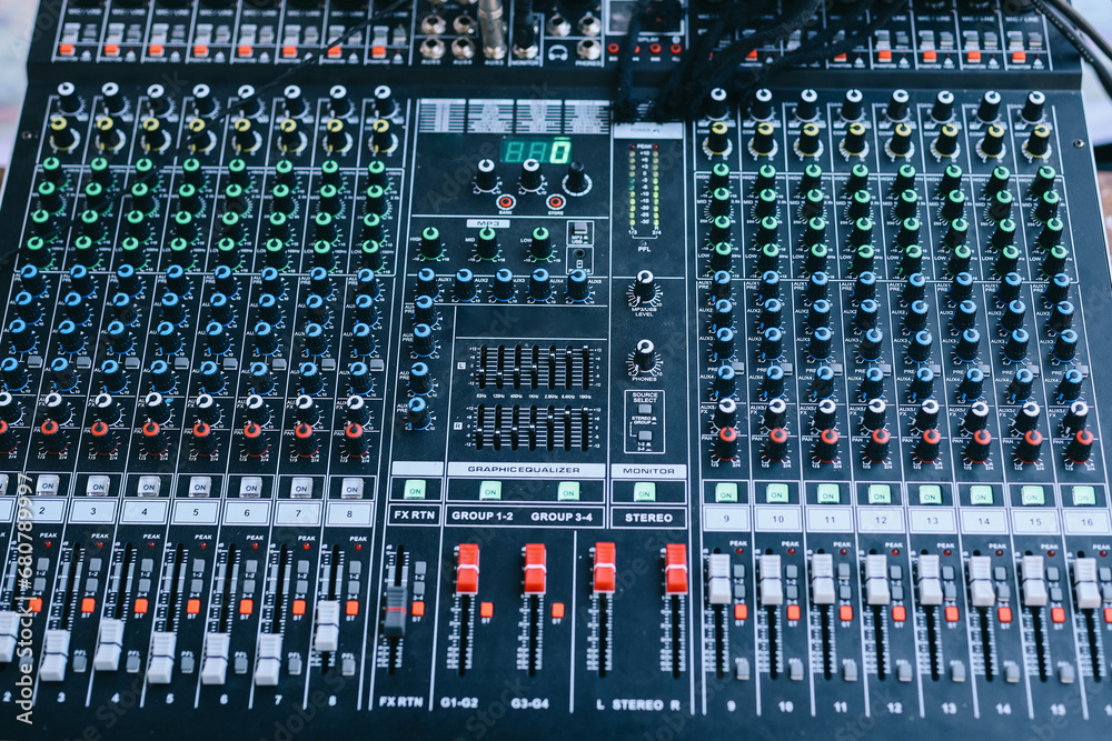 Professional sound and audio mixer control panel with buttons and sliders Professional sound and audio mixer control panel with buttons and sliders