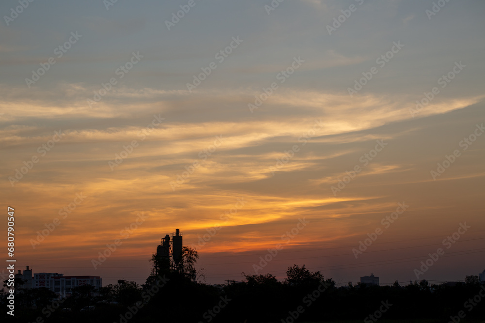 Landscape at morning time over sunrise and mist background and foreground grass silhouette