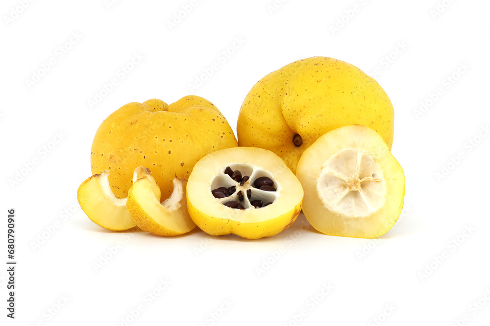 Halved quince with seeds visible over white background