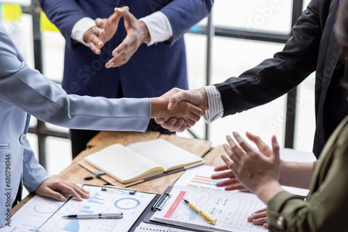 Business Team offer and give hand for handshake in office. Successful job interview. Apply for loan in bank. Salesman, bank worker or lawyer shake for deal, agreement or sale. Increase of salary.	 photo