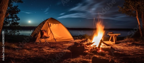 camping tent with campfire, camping at night