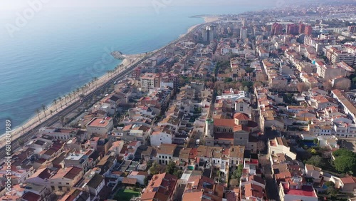 Aerial view of residential areas and the coast of the small Catalan town of Vilasar de Mar, Spain.  photo