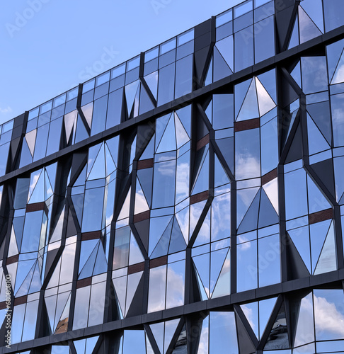 unique reflective glass building (modern architecture reflecting the sky) brooklyn abstract tower in dumbo (windows, high rise, skyscraper, cold style) angular distinctive diamond shaped window 