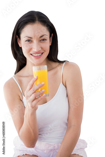 Digital png photo of happy biracial woman holding glass with juice on transparent background