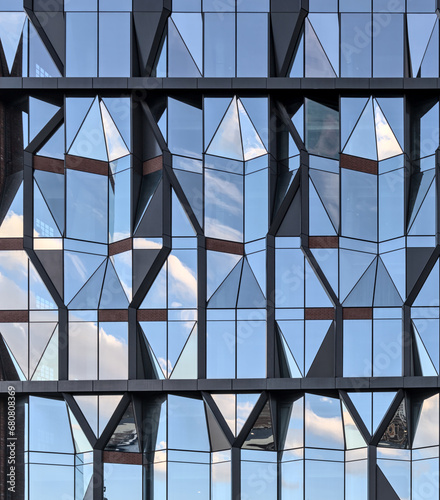 unique reflective glass building (modern architecture reflecting the sky) brooklyn abstract tower in dumbo (windows, high rise, skyscraper, cold style) angular distinctive diamond shaped window 