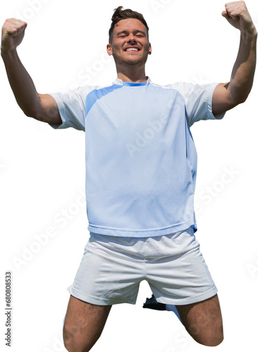 Digital png photo of happy caucasian football player kneeling, arms in air on transparent background