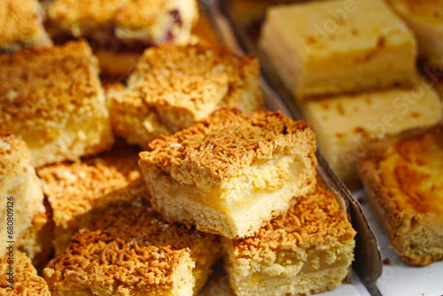 Slices of sweet pie with filling on the table.