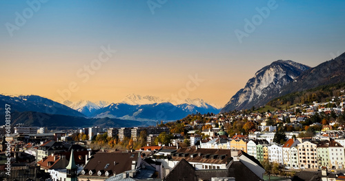 The cityscape view in Innsbruck  as city center town with beautiful houses, river Inn and Tyrol Alps, Austria © SASITHORN