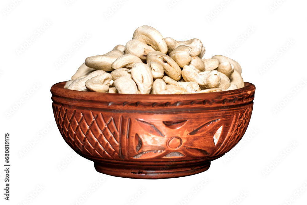 Cashew nuts in a clay bowl isolated on a transparent background, A Clipping path is included for easy selection Cashew nuts in a clay bowl isolated on a transparent background, A Clipping path is included for easy selection