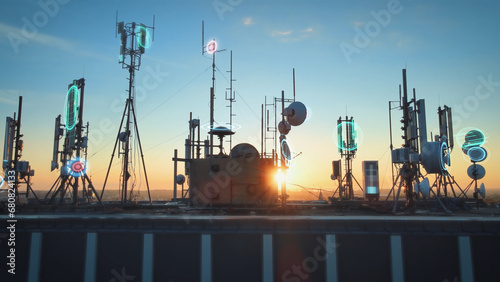Rooftop base station at sunset covered with telecom tower antenna with graphics of broadcasting receiver signal quality data coverage photo