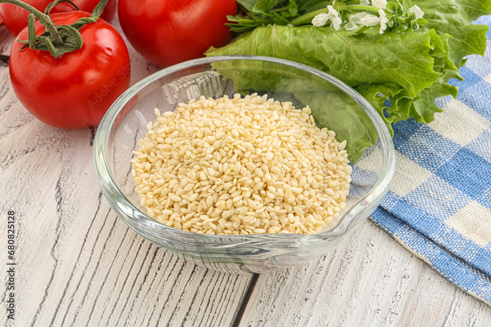 Raw sesame seeds in the bowl Raw sesame seeds in the bowl